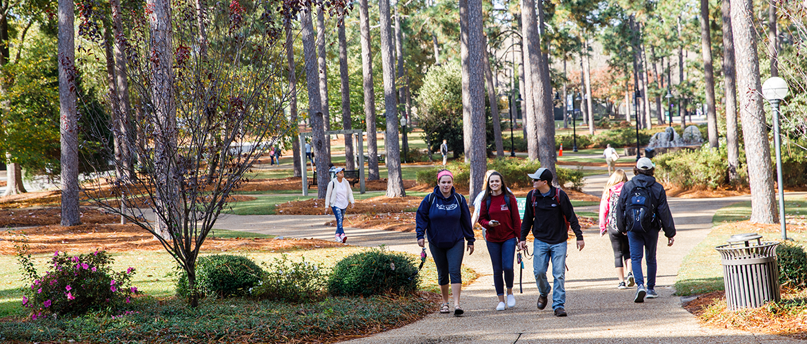 Wide shot of students walking through the quad